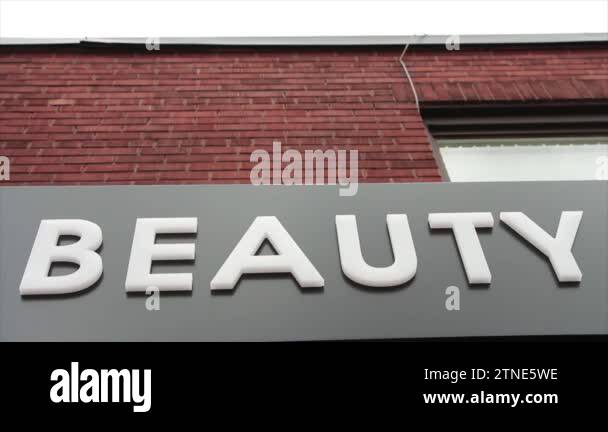 horizontal sign that says beauty caption writing text on it in white ...