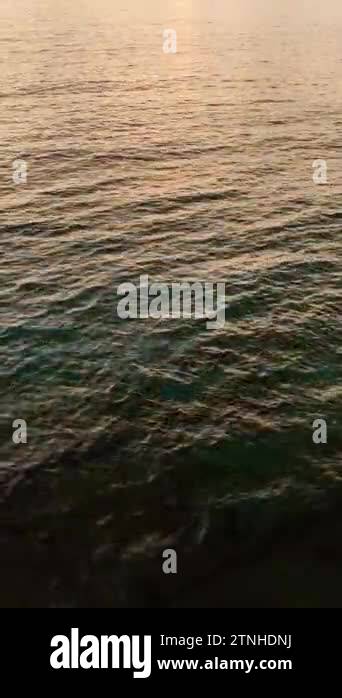 Behold the breathtaking vista of a sea sunset as the sun dips below the ...
