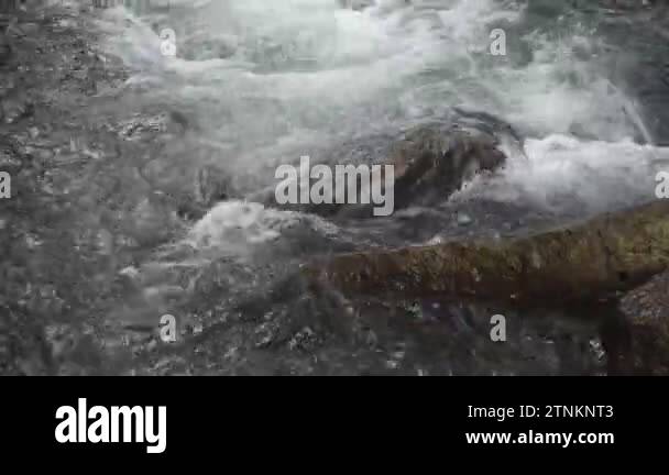 water falling on river pass rock and stone at Kho Chong Lom waterfall ...
