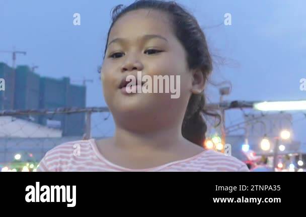Slow motion reactions and facial expressions of an Asian girl who ...