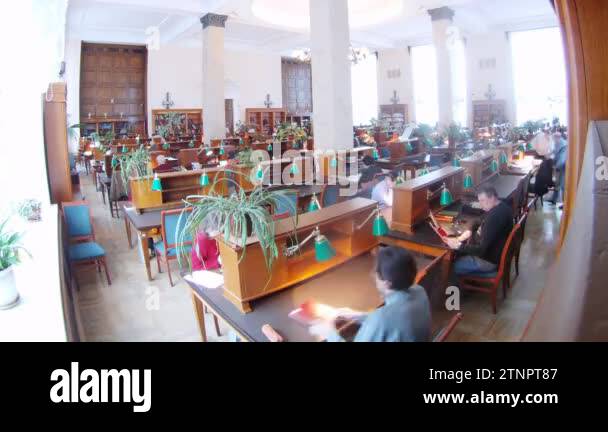 People sit in state library in reading room Stock Video Footage - Alamy