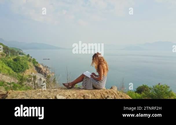 Girl sitting on high hill Stock Videos & Footage - HD and 4K Video ...