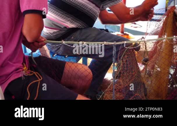 Fishermen Repair Fishnet Fishing Lines Stock Video Footage - Alamy