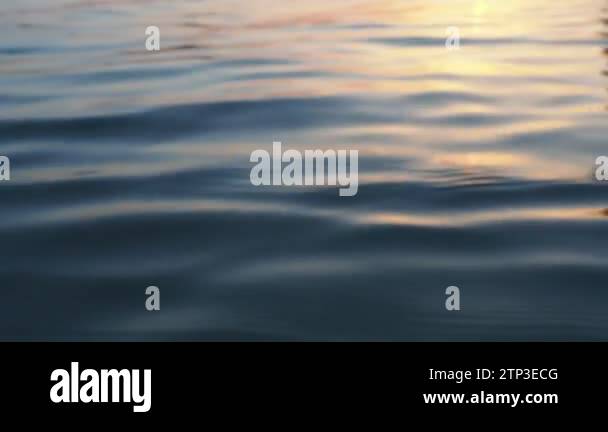 Calm water with ripples and smooth waves. Water texture. Water surface ...