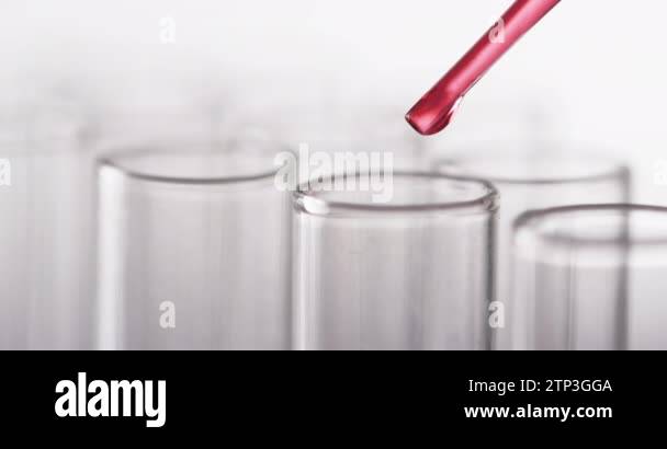 Video of glass laboratory test tubes and pipette with red liquid and ...