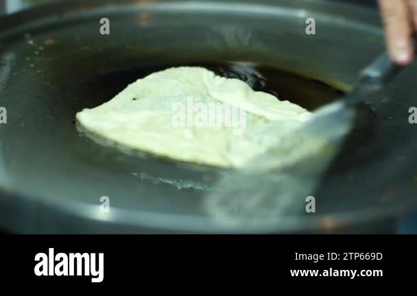 Roti Making, roti thresh flour by roti maker with oil. Thai Pancake ...