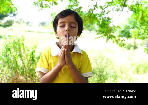 Portrait of Happy Indian Boy Praying and worship to God in School. Hand ...