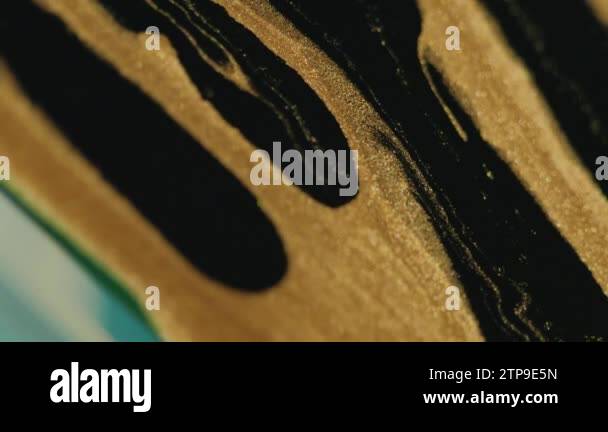 Glitter paint spill. Fluid background. Sparkling liquid. Golden black ...