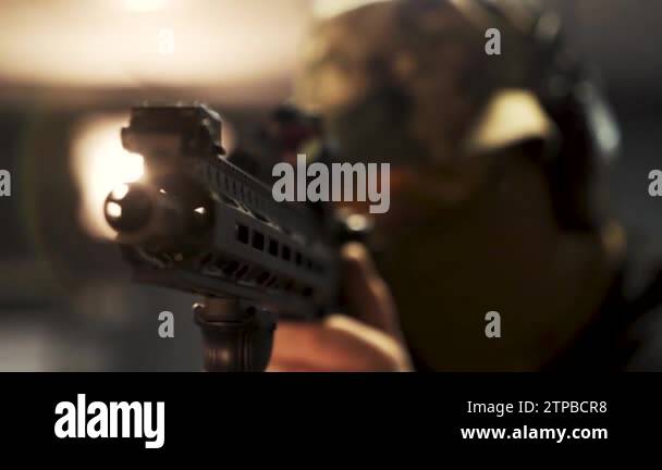 soldier in military uniform holds a machine gun and takes aim. Military ...