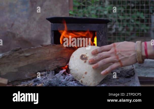 Roti or Chapati Making or Baking on Hearth in Indian Traditional Way