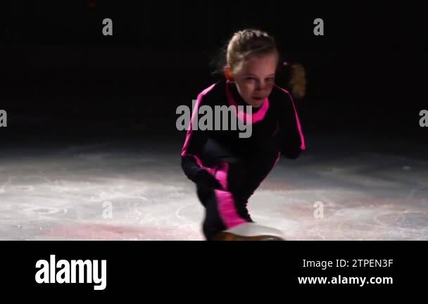 Figure Skating Rotation A professional little figure skater at the figure skating competitions ...