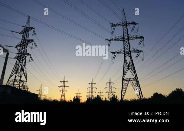Electricity pylons in the evening.Silhouettes of high voltage power ...