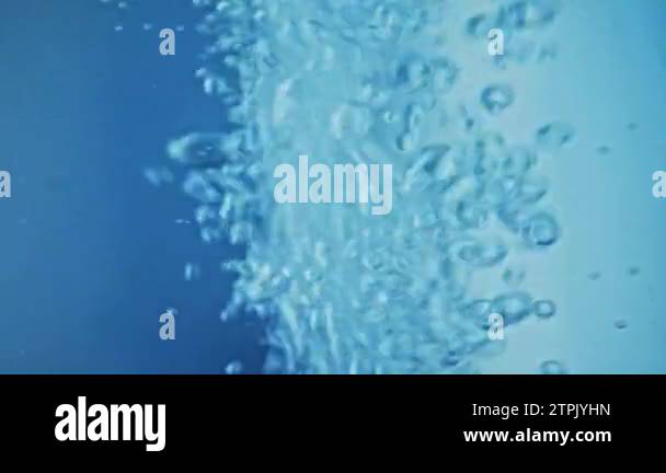 Air bubbles underwater rising from bottom to surface. Stream of oxygen ...