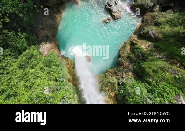 Drone footage of a beautiful waterfall in the Philippines with blue ...