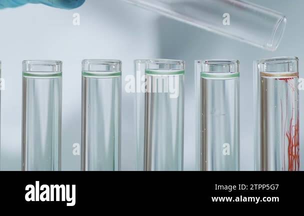 Scientist is conducting an experiment with test tubes Stock Videos ...