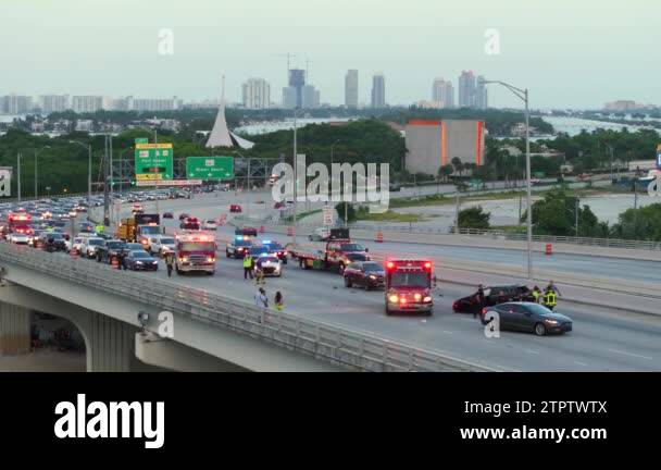 First responders personnel and vehicles responding to car accident site ...