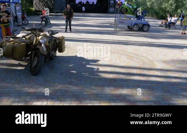 Rare old motorcycle with a sidecar without a rider travels around in a ...