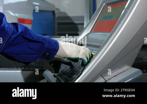 Mechanical technician programming punching the machine CNC. A man ...