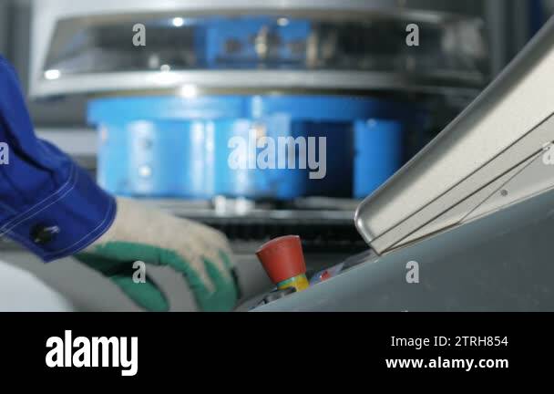 Mechanical technician programming punching the machine CNC. A man ...