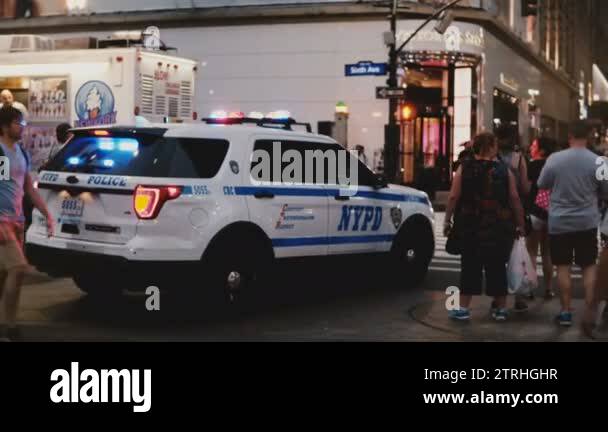 NEW YORK AUG 18 2017 - NYPD police car with flasher on slowly moving ...