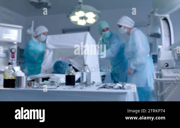 Surgeon and nurses performing an operation Stock Videos & Footage - HD ...
