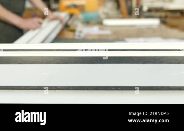 Production and manufacturing of pvc windows, the worker marks the size ...