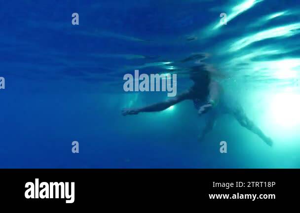 Beautiful young woman swimming in swimming pool underwater view Stock ...