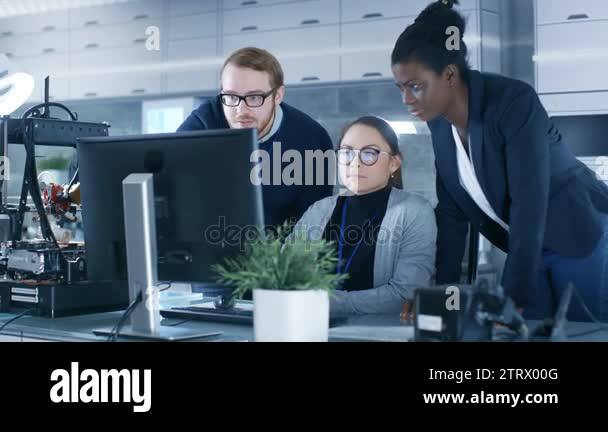Diverse Team of Research Engineers Working in a high Tech Laboratory on ...