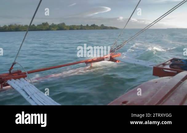 Looking back on a boat ride as the pontoon crashes through the water ...