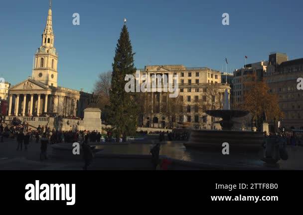 LONDON - circa 2017:People visit Trafalgar Square in London.One of the