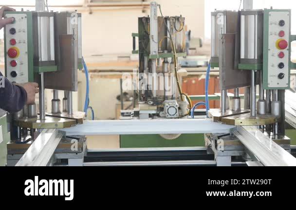 Automatic line machine for sticking together PVC sections of windows ...
