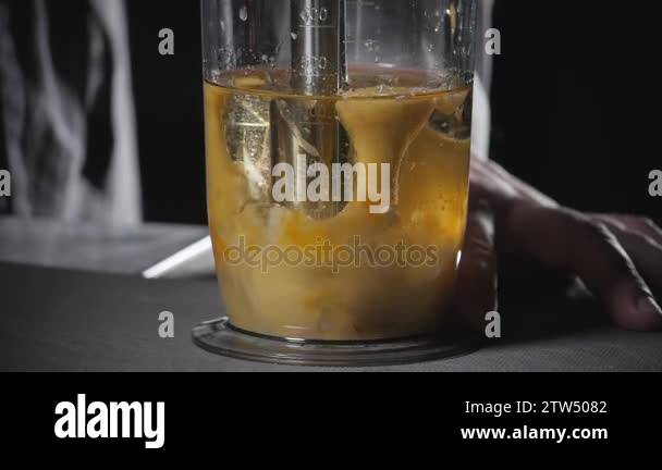 squeeze the juice of a lemon. Beating of homemade mayonnaise with olive