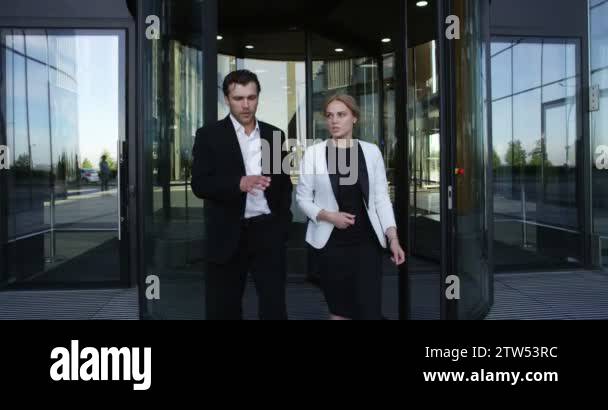 Two business people walking outdoors office building Stock Video ...