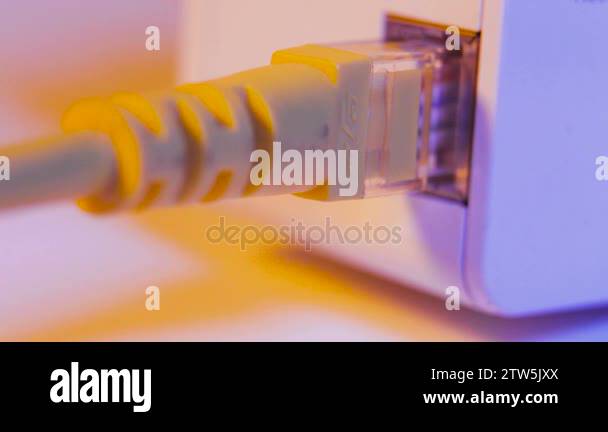 Macro close up of WiFi extender in electrical socket on the wall with