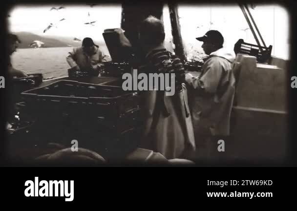 https://c8.alamy.com/comp/2tw69kd/fishermen-at-the-fishing-boat-old-vintage-movie-effect-2tw69kd.jpg