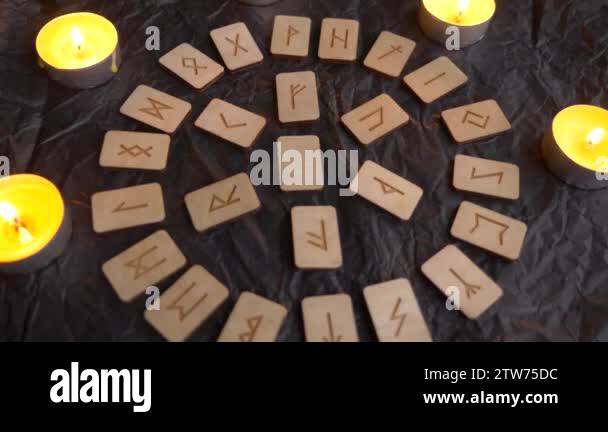 Wooden rune wheel. runic layout and candles, 4k, slow-motion shooting ...