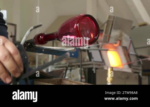 Glassblowing Professional Working on Torch Flame with Glass Tubes