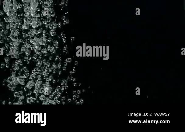 Falling raindrops footage animation in slow motion on black background ...