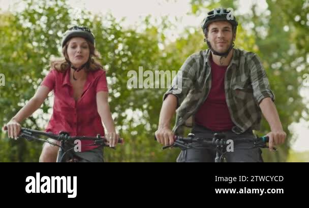 Romantic active couple riding e-bike bicycles mtb on a beautiful ...
