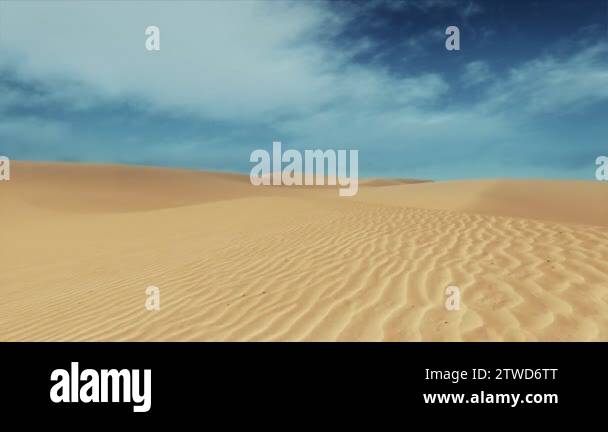 Motion through abstract sandy desert dunes under blue sky with clouds