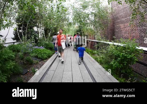 NEW YORK CITY - MAY 16, 2015: People walking on the High Line Park. The ...