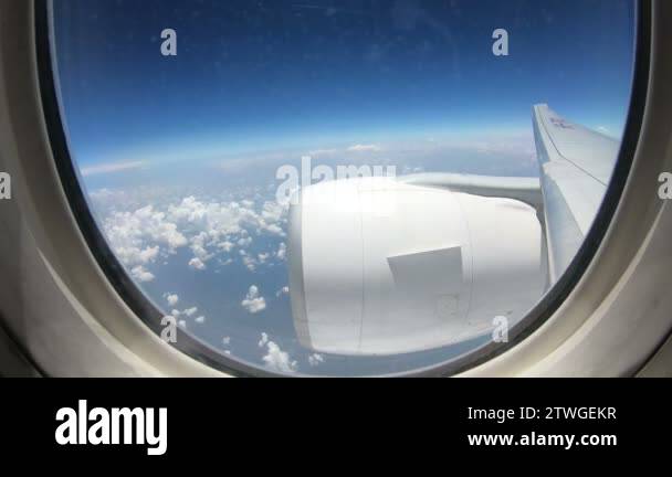 4K Time lapse inflight commercial airplane windows view with big engine ...