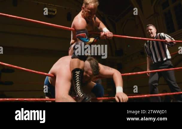Pro Wrestling Ropes Pro Wrestling Match (Slow Motion): Wrestler Choking Opponent on Ring ...