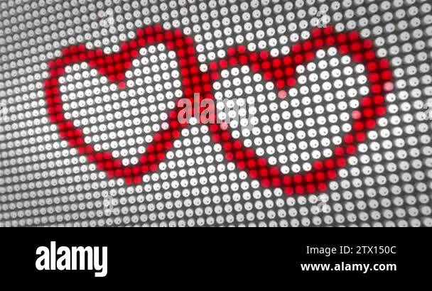 Red hearts icons beating on big LED display with large pixel. Hearts ...