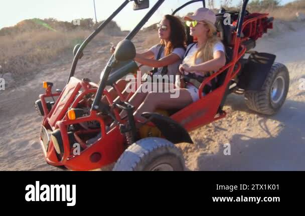 Female driver ride on buggy car. Enjoy extreme ride. Tourists driving ...