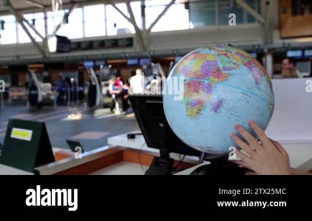 Checvking A Rmap Woman checking globe map at information desk inside YVR airport Stock ...