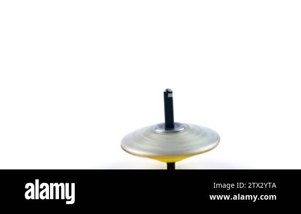 a spinning top rotates frantically as symbol of equilibrium movement ...