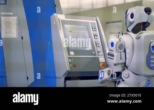 Machine Looking Left Robot comes to a machine and types, back view Stock Video Footage - Alamy