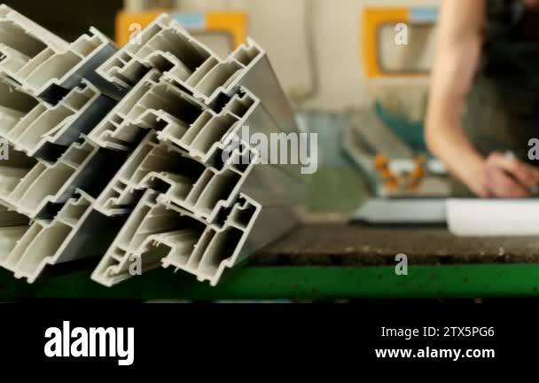 Production and manufacturing of pvc windows, the worker marks the size ...