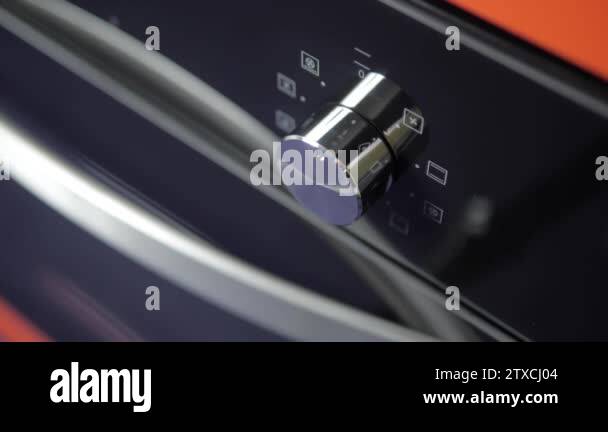 Metallic Toggle Switch of the Cooker Oven. Close-up View. Digital Clock ...